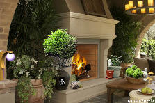 Garden design:I love this room.This is a outdoor living room with a beautiful fireplace. I added european larch as table orbs with a mixture of planters and adding minature gazebos and statues as interior design props. I dd one import with a fluer de le which is one of my favorites symbols representing royality. Garden design:Fireside Fusion